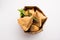 SamosaÂ Snack is an Indian deep fried pastry with a spiced filling usually made with potatoes, spices and herb